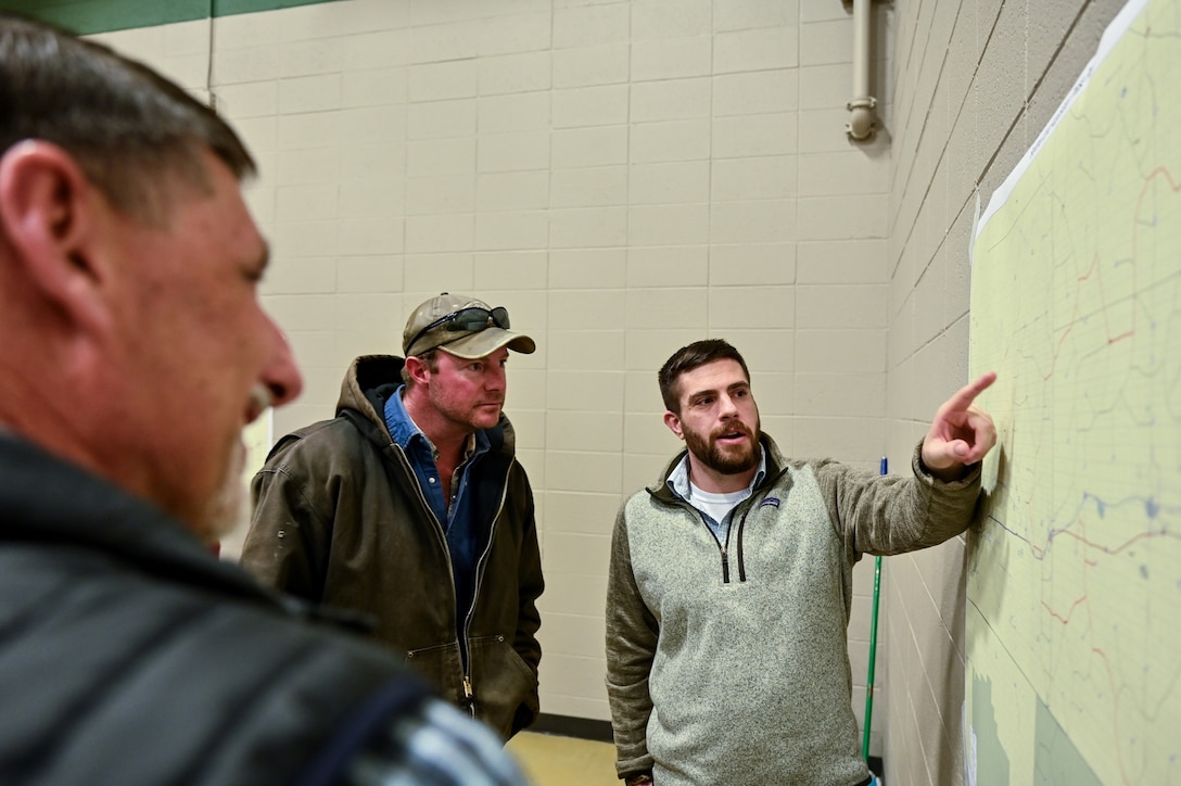 Omaha District Senior Realty Specialist, Vince Crowdy talks with landowners and local community members at Pine Bluffs Community Center, March 27, 2023. The U.S. Air Force partnered with USACE held a county meeting for the local public in Pine Bluffs, WY to discuss upcoming real estate acquisitions in the area.