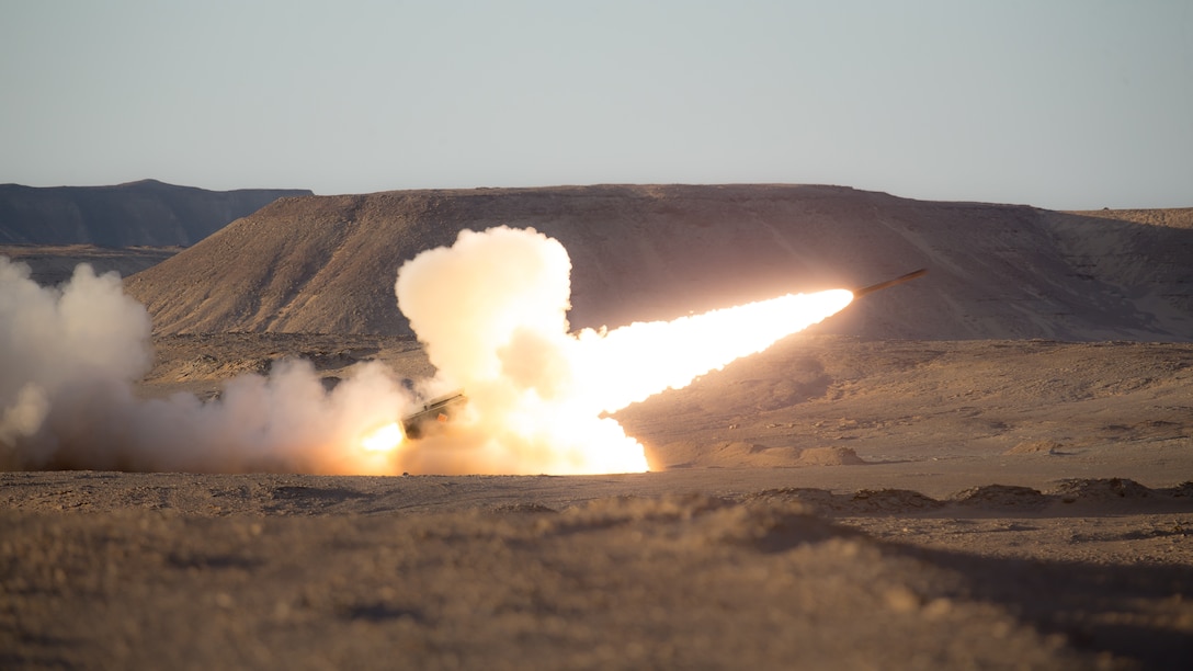 A U.S. Marine Corps High Mobility Artillery Rocket System assigned to HIMARS Detachment, Battalion Landing Team 1/4, 15th Marine Expeditionary Unit, fires a rocket during a theater amphibious combat rehearsal in Tabuk, Kingdom of Saudi Arabia, March 8. TACR integrates U.S. Navy and Marine Corps assets to practice and rehearse a range of critical combat-related capabilities available to U.S. Central Command, both afloat and ashore, to promote stability and security in the region. The 15th MEU is deployed to the U.S. 5th Fleet area of operations in support of naval operations to ensure maritime stability and security in the Central Region, connecting the Mediterranean and Pacific through the Western Indian Ocean and three strategic choke points.