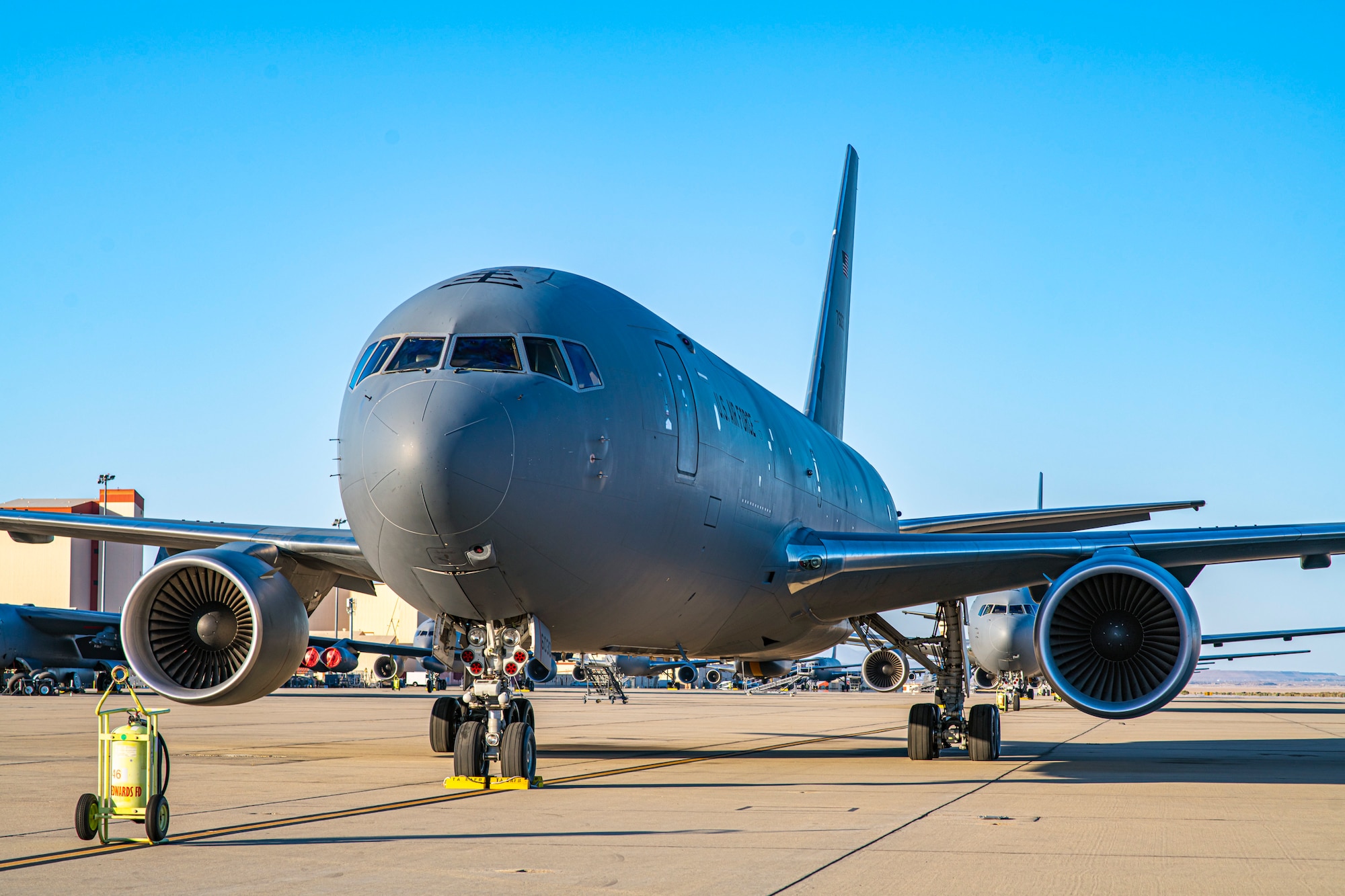 A KC-46 Pegasus assigned to the 22nd Air Refueling Wing out of McConnell Air Force Base, Kansas, is parked along with the rest of its fleet at Edwards Air Force Base, California, May 11. The 22nd ARW relocated most of their aircraft due to inclement weather due to hit the Kansas. (Air Force photo by Giancarlo Casem)