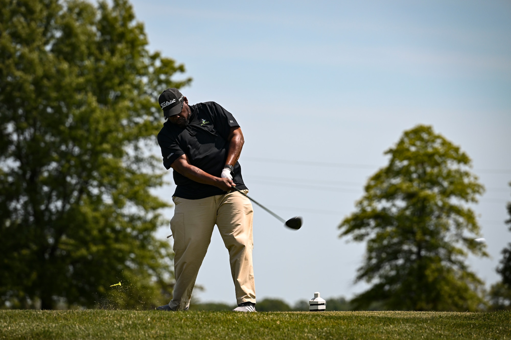 A participant tees off during the Bluesuiters Golf Tournament at Jonathan’s Landing Golf Course in Magnolia, Delaware, May 11, 2023. Bluesuiters is a biannual golf tournament aimed at connecting Team Dover Airmen with local civic and business leaders. (U.S. Air Force photo by Staff Sgt. Marco A. Gomez)