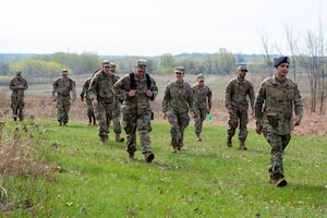 Members of the 934th Security Forces Squadron count their steps as part of the pace count process during a land navigation course at Arden Hills, Minnesota, on May 7, 2023. The 934 SFS conducted a routine land navigation course to refresh and brush up on the arduous process of using a compass and pace count. (U.S. Air Force photo by Senior Airman Matthew Reisdorf)