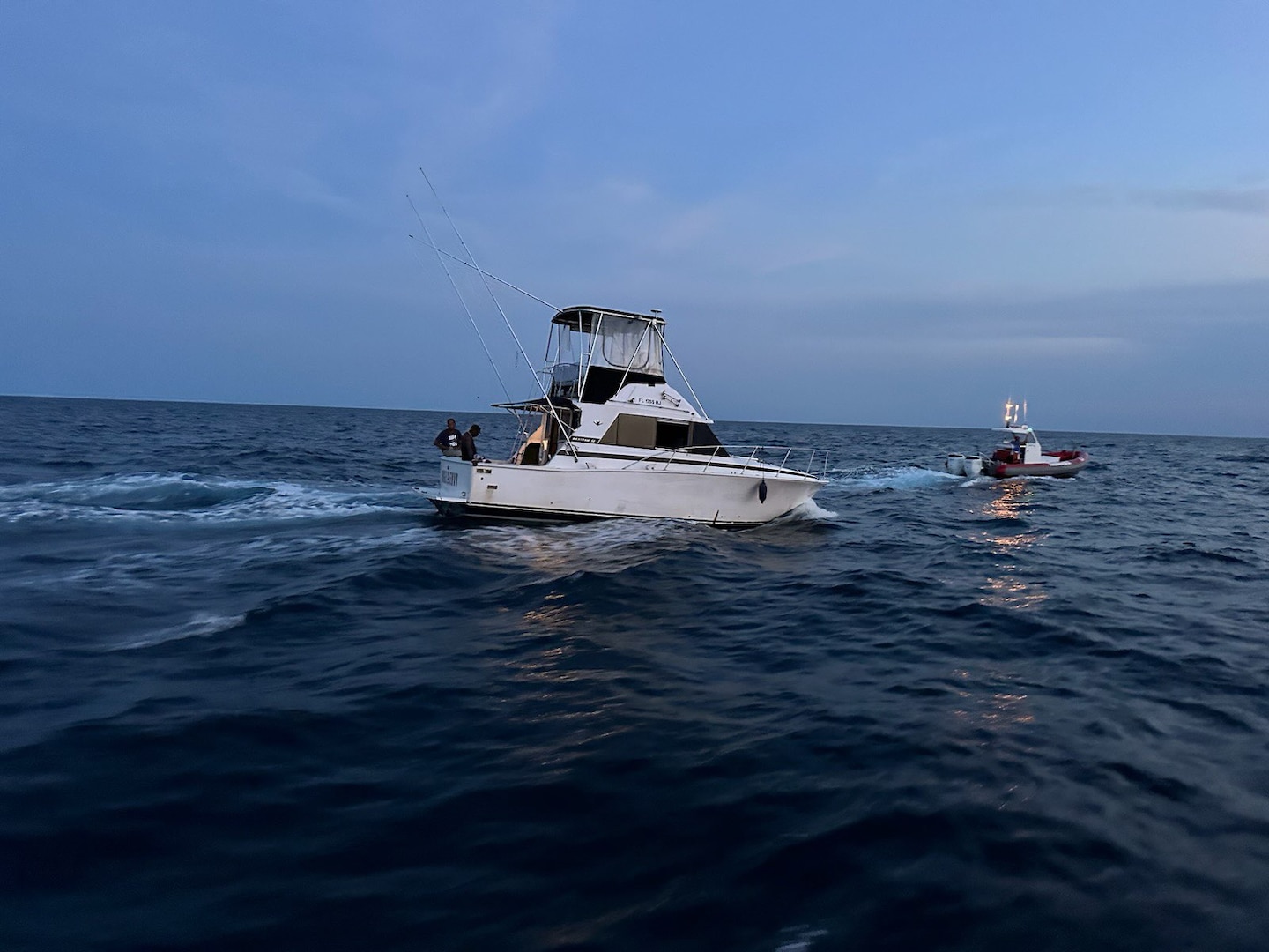 A disabled migrant vessel is interdicted while on a voyage from Freeport, Bahamas to West Palm Beach, Florida, May 5, 2023. Nineteen people were aboard the vessel and were interdicted about 25 miles east of Fort Pierce Inlet, Florida. (U.S. Coast Guard photo)