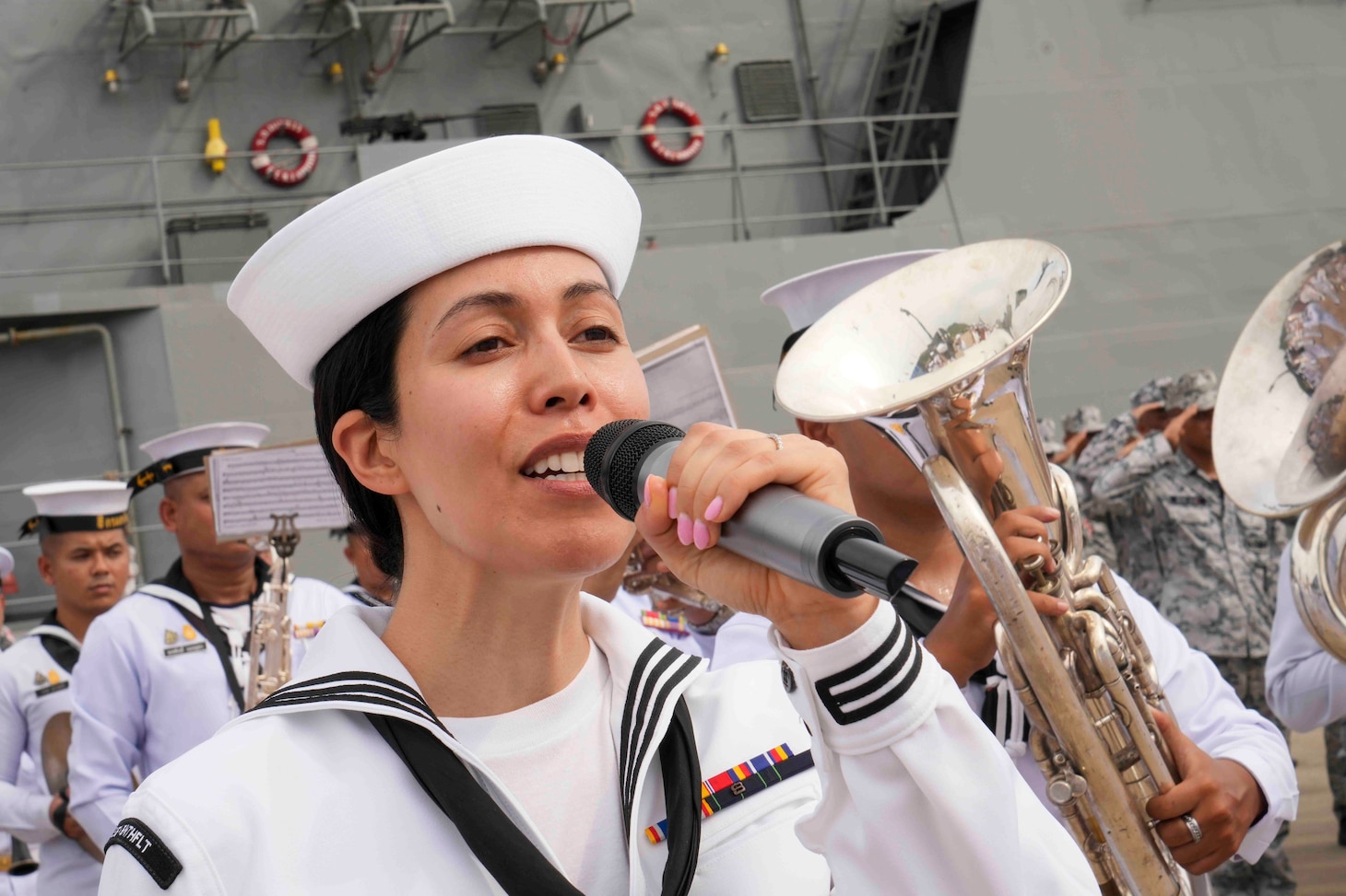 Musician 3rd Class Marisol Arreola sings the U.S. national anthem during the opening ceremony of Cooperation Afloat Readiness and Training (CARAT)/Marine Exercise (MAREX) Thailand 2023 at Royal Thai Fleet Headquarters, May 8. CARAT/MAREX Thailand is a bilateral exercise between the Kingdom of Thailand and United States to promote regional security cooperation, practice humanitarian assistance and disaster relief, and strengthen maritime understanding, partnerships and interoperability. Thailand has been part of the CARAT exercise series since 1995. In its 29th year, the CARAT series is comprised of multinational exercises, designed to enhance U.S. and partner forces’ abilities to operate together in response to traditional and non-traditional maritime security challenges in the Indo-Pacific region.