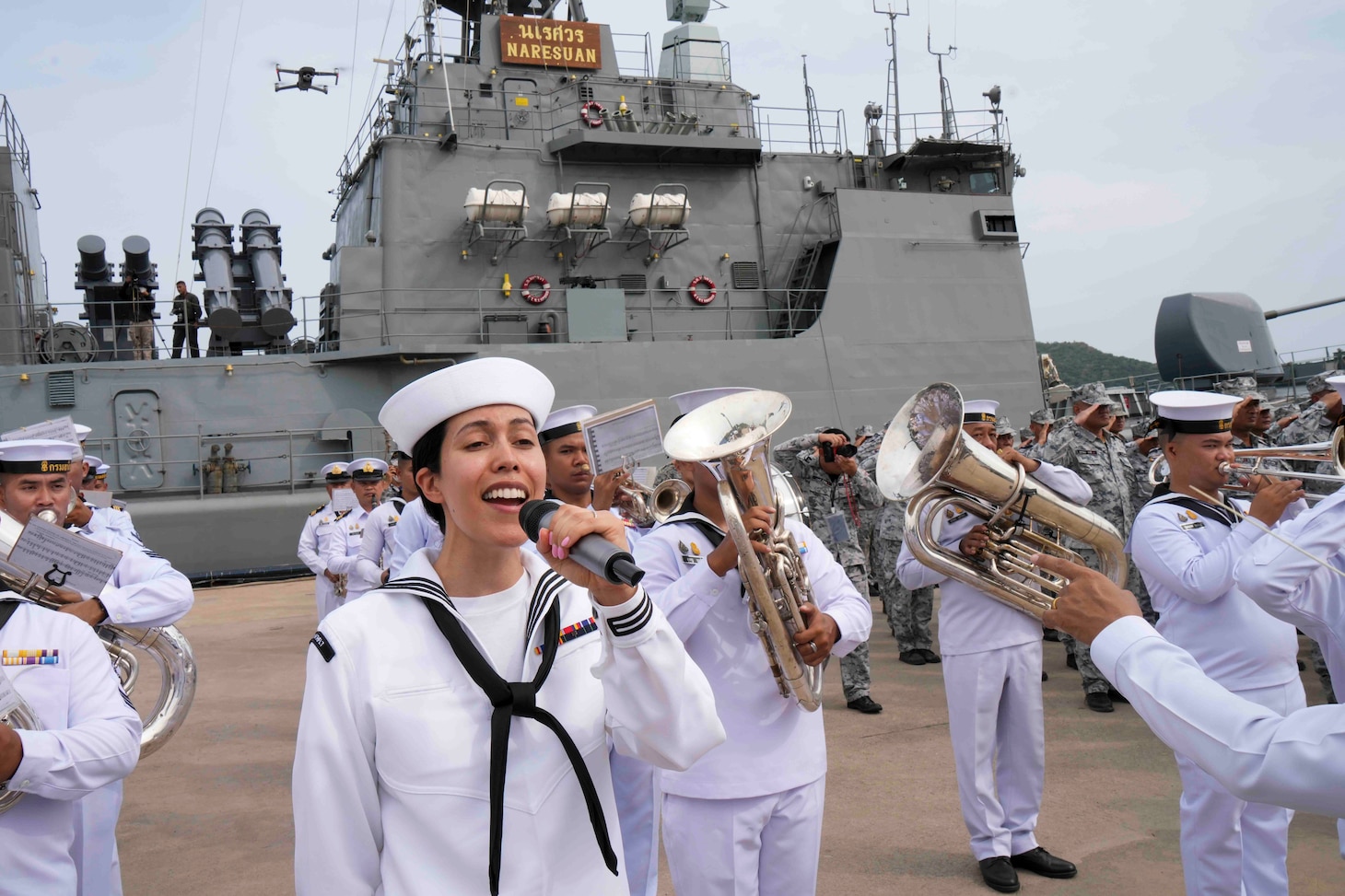 Musician 3rd Class Marisol Arreola sings the U.S. national anthem during the opening ceremony of Cooperation Afloat Readiness and Training (CARAT)/Marine Exercise (MAREX) Thailand 2023 at Royal Thai Fleet Headquarters, May 8. CARAT/MAREX Thailand is a bilateral exercise between the Kingdom of Thailand and United States to promote regional security cooperation, practice humanitarian assistance and disaster relief, and strengthen maritime understanding, partnerships and interoperability. Thailand has been part of the CARAT exercise series since 1995. In its 29th year, the CARAT series is comprised of multinational exercises, designed to enhance U.S. and partner forces’ abilities to operate together in response to traditional and non-traditional maritime security challenges in the Indo-Pacific region.