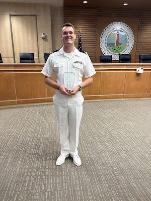 230508-N-N1526-0003 VIRGINIA BEACH, Va. (May 8, 2023) Lt. j.g. Paul Strunc, a critical care nurse at Naval Medical Center Portsmouth, poses for a photo after being presented the Virginia Beach Mayor’s Lifesaving Award by Mayor Bobby Dyer at City Hall ,May 8.. Strunc was recognized for administering lifesaving cardiopulmonary resuscitation on a civilian at the beach on Oct. 2, 2022. Through his rapid intervention and emergency response, the person was stabilized until ambulatory services arrived on the scene. (U.S. Navy photo by Lt. Nube Macancela)