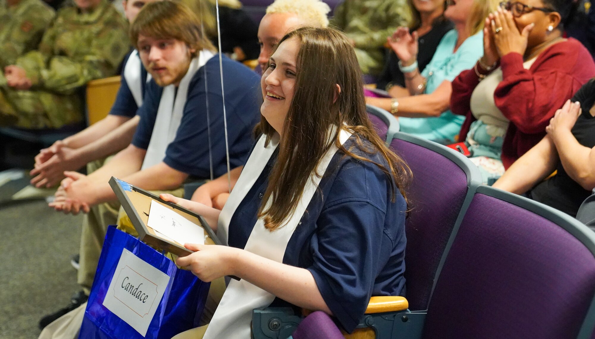 Candace Taylor, Project SEARCH intern, smiles after receiving her diploma at the Project SEARCH graduation ceremony in the George Budz Auditorium on Keesler Air Force Base, Mississippi, May 12, 2023.