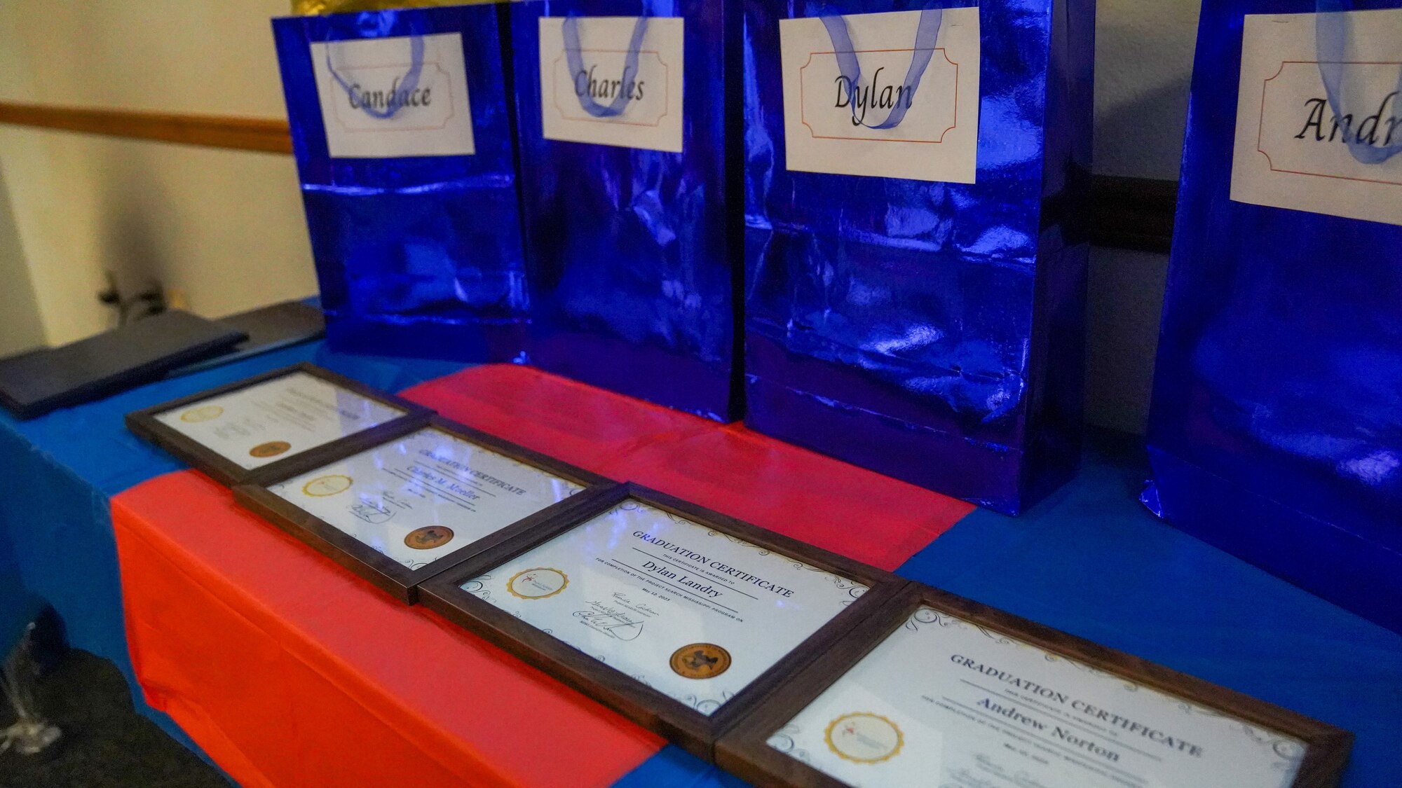 Diplomas and gift bags are displayed in the George Budz Auditorium for the Project SEARCH graduation at Keesler Air Force Base, Mississippi, May 12, 2023.
