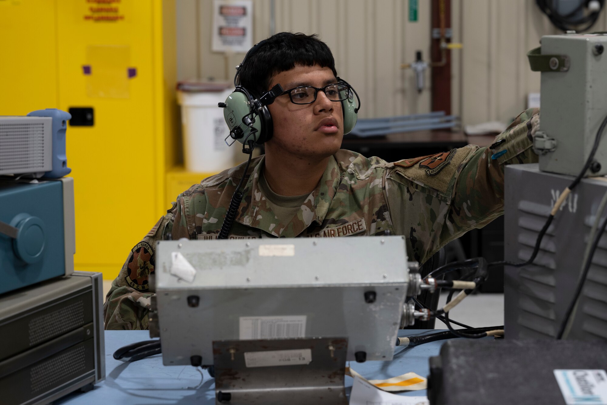 U.S. Air Force Airman 1st Class Jose Julio Aguilar, 49th Component Maintenance Squadron F-16 Viper avionics apprentice, tests an ultra-high frequency radio transmitter at Holloman Air Force Base, New Mexico, May 1, 2023. The 49th CMS avionics shop provides on and off-equipment maintenance support for assigned F-16 aircraft enabling pilot production. (U.S. Air Force photo by Airman 1st Class Michelle Ferrari)