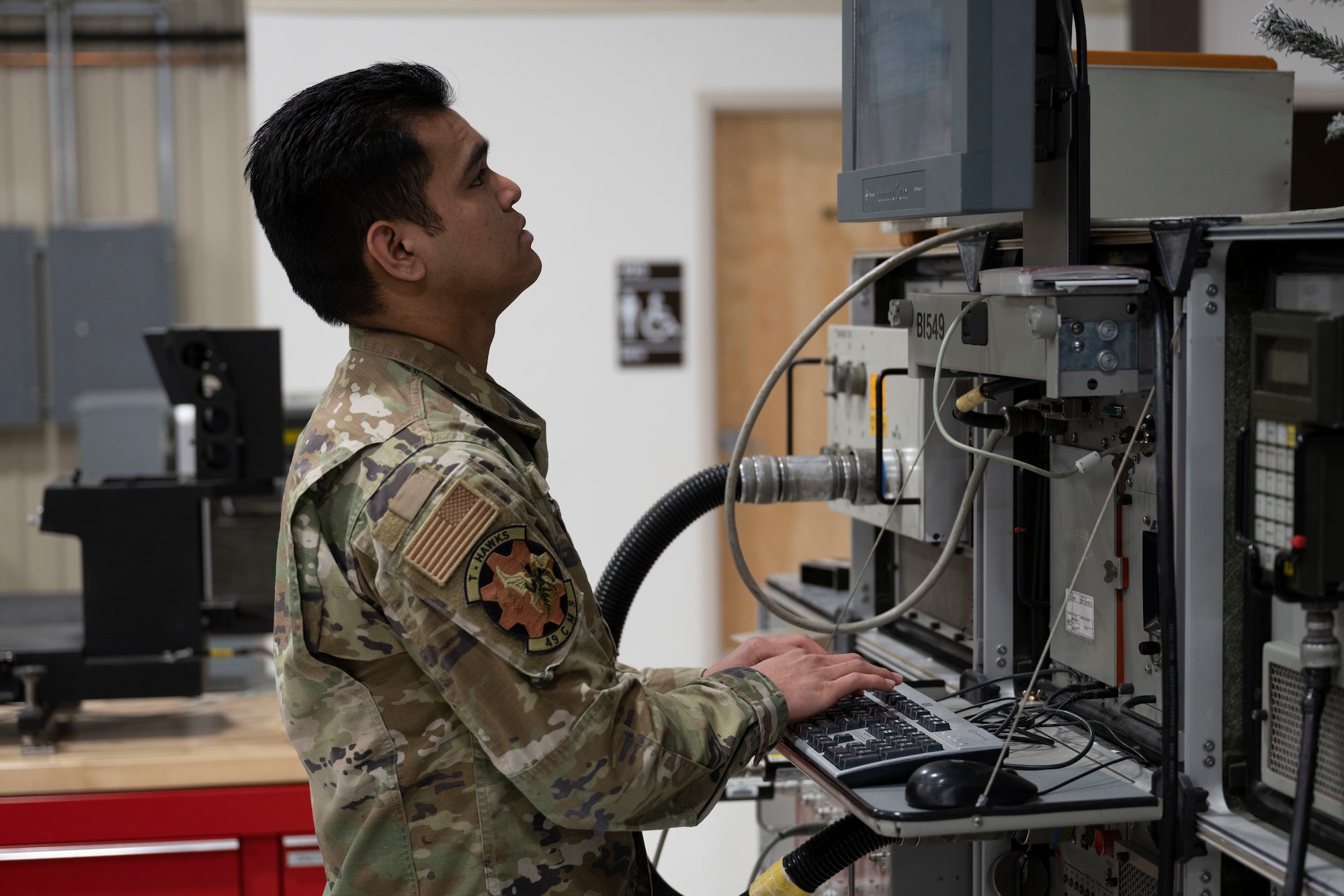 U.S. Air Force Airman 1st Class Steven Perez, 49th Component Maintenance Squadron F-16 Viper avionics apprentice, runs self-diagnostics to ensure machinery is working correctly at Holloman Air Force Base, New Mexico, May 1, 2023. The 49th CMS avionics shop provides on and off-equipment maintenance support for assigned F-16 aircraft enabling pilot production. (U.S. Air Force photo by Airman 1st Class Michelle Ferrari)