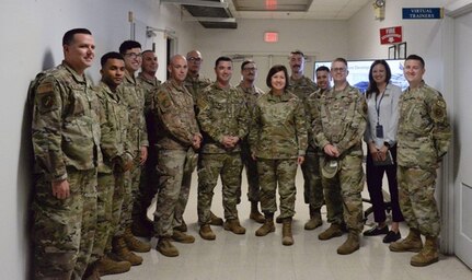 Chief Master Sgt. of the Air Force JoAnne S. Bass poses with members of the 365th Training Squadron after touring the virtual reality classrooms May 8, 2023, at Sheppard Air Force Base, Texas. Bass visited Team Sheppard taking the opportunity to experience the mission and vision of Sheppard AFB. (U.S. Air Force photo by Airman 1st Class Katie McKee)