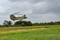 A CH-47 Chinook assigned to the 1st Battalion, 228th Aviation Regiment prepares to land during exercise Keel Billed Toucan 2023 at a Servicio Nacional Aeronaval (SENAN) base May 7, 2023, in Nicanor, Panama.