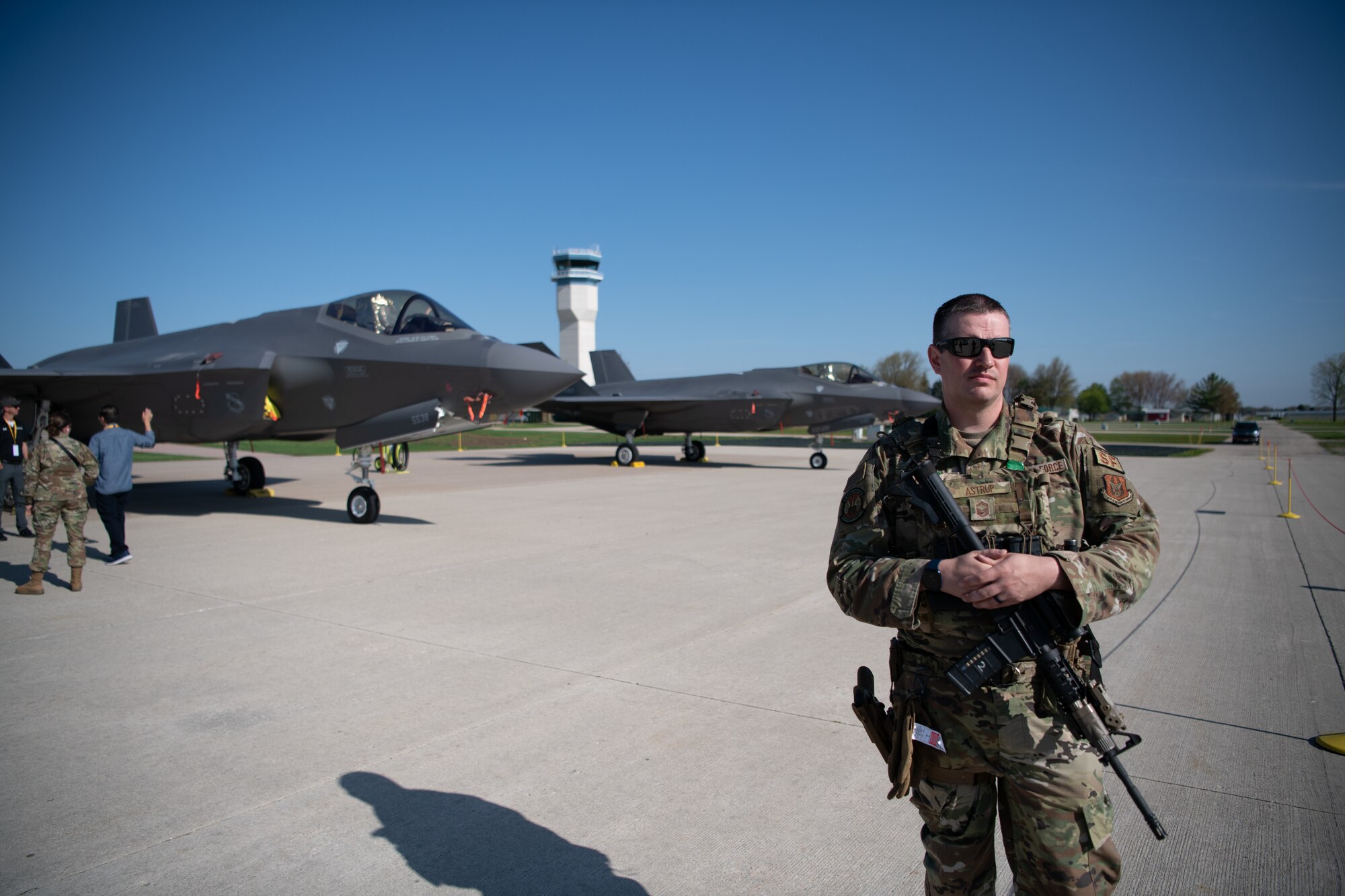 An Airman provides security for an F-35 Lightning II aircraft static display
