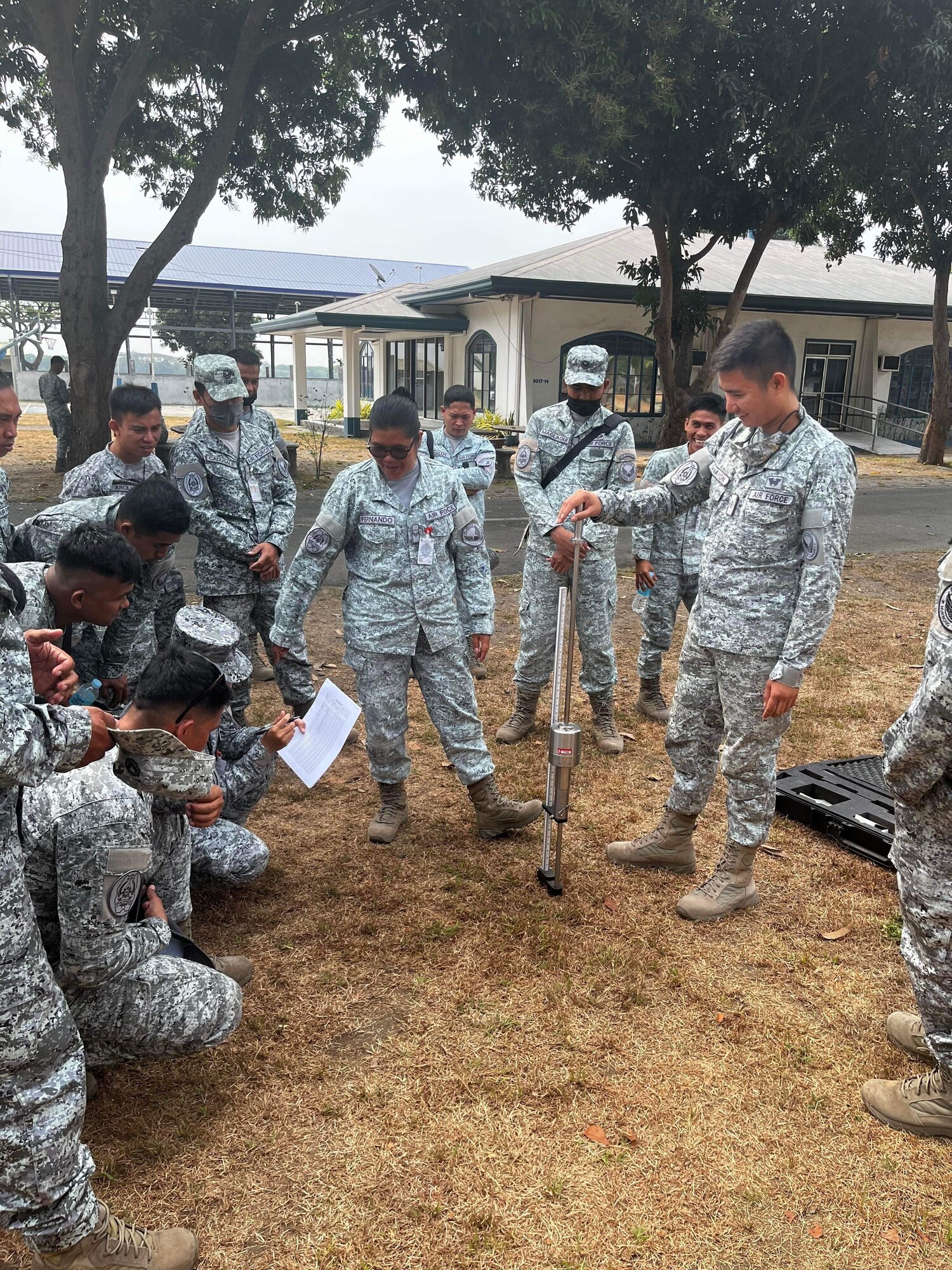 Philippine air force members with the 355th Aviation Engineer Wing demonstrate the use of a dynamic cone penetrometer during a subject matter expert exchange with the with the 18th Civil Engineer Group in the Philippines, Apr 12, 2023. The SME exchange event allowed members of the 18th Wing’s 18th CEG and PAF 355th AEW to share techniques and procedures on airfield damage repair. (Courtesy photo from Philippine air force public affairs)
