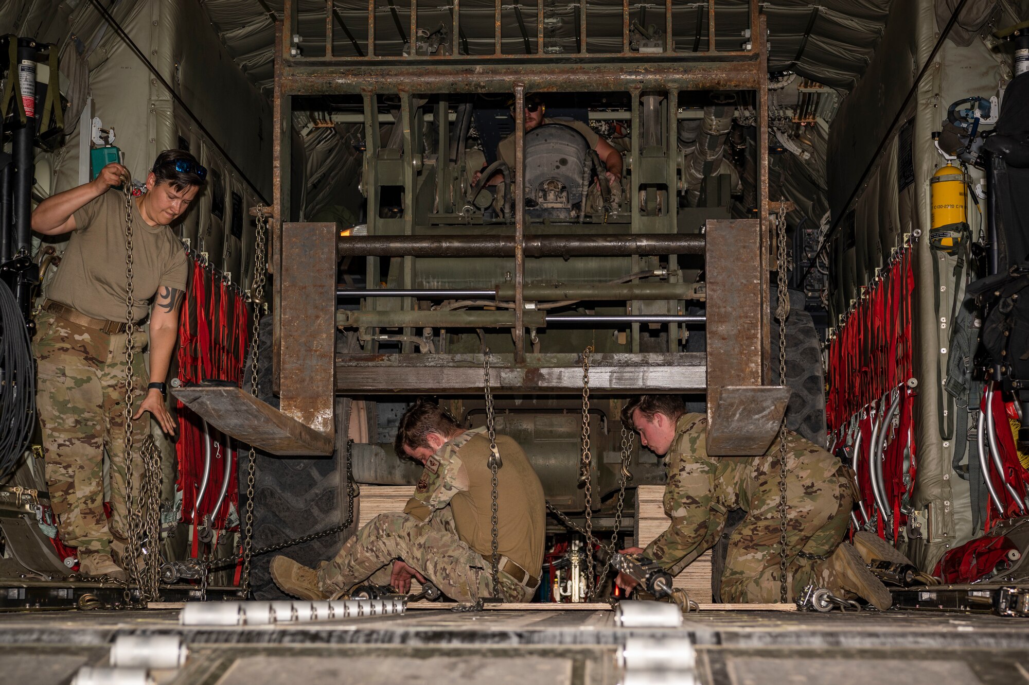 U.S. Air Force Airmen from the 386th Expeditionary Logistics Readiness Squadron and the 40th Expeditionary Airlift Squadron secure a forklift on a C-130J Super Hercules during Operation Agile Marauder 23.1 at Ali Al Salem Air Base, Kuwait, May 11, 2023.