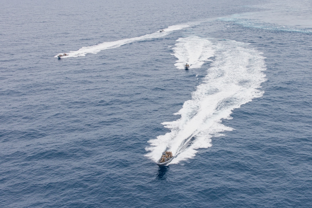 U.S. Marines and Sailors with the 26th Marine Expeditionary Unit (MEU) conduct a visit, board, search and seizure during Amphibious Ready Group/MEU Exercise (ARGMEUEX), Atlantic Ocean, April 17, 2023. Maritime Interception Operations are utilized to capture enemy vessels, combat terrorism, piracy, and smuggling. The Bataan ARG and 26th MEU provide geographic combatant commanders with a wide range of flexible capabilities including maritime security operations, crisis response, sea control, counter-terrorism, and humanitarian assistance and disaster relief. (U.S. Marine Corps photo by Cpl. Kyle Jia)