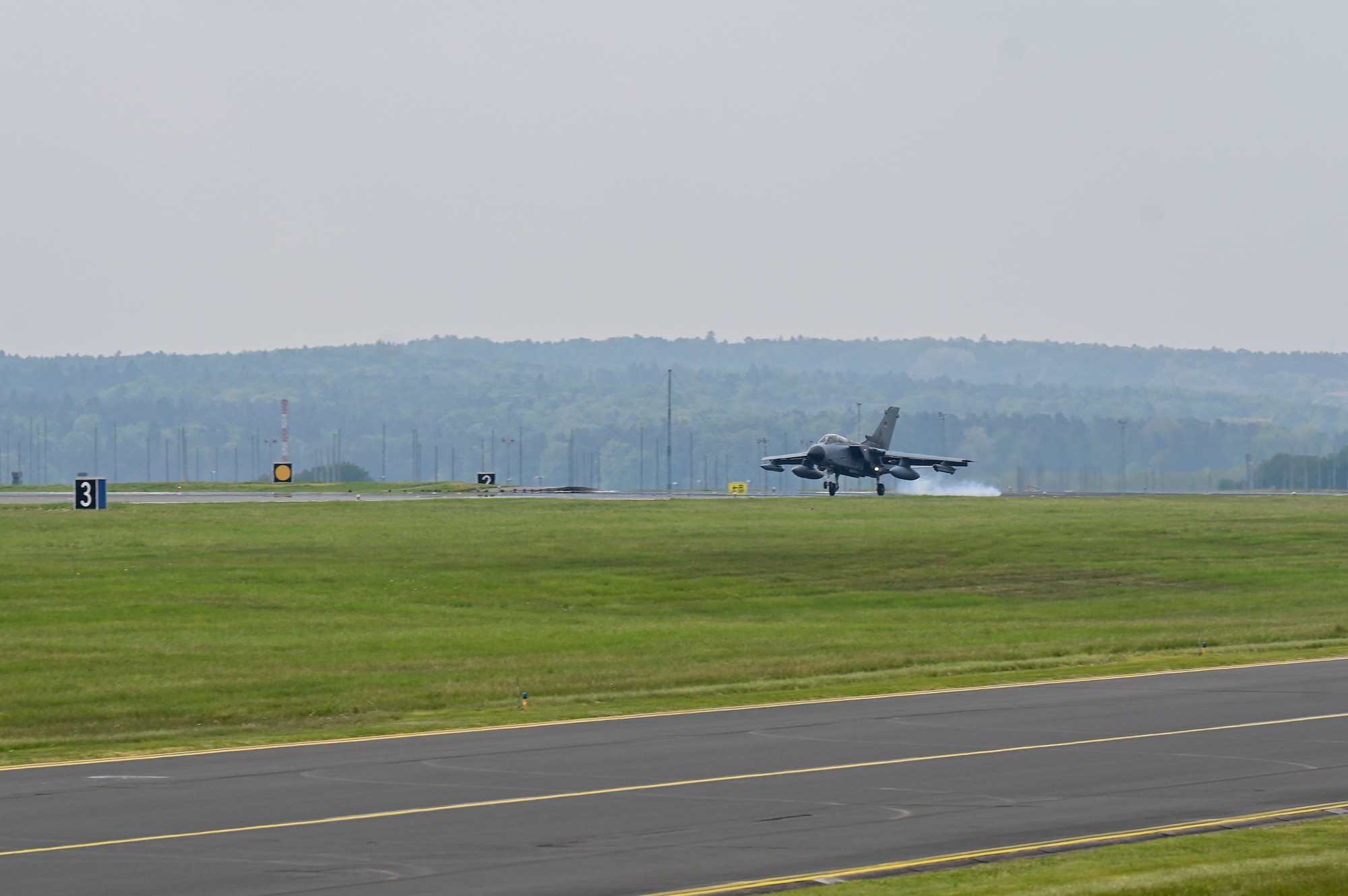 A German Air Force PA-200 Tornado aircraft assigned to Tactical Air Wing 33, Büchel Air Base, Germany, lands at Spangdahlem AB, Germany, May 15, 2023. For approximately three weeks, the aircraft will conduct training and interoperability missions from Spangdahlem AB. (U.S. Air Force photo by Senior Airman Jessica Sanchez-Chen)