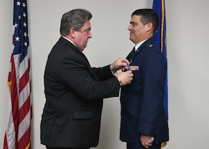 U.S. Air Force officer having medal pinned