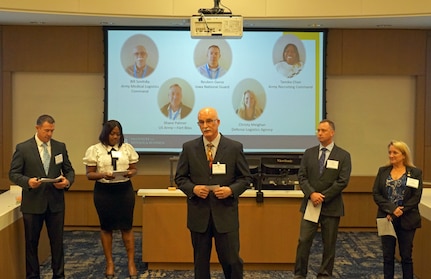 Bill Sovitsky, center, speaks during capstone presentations for an Institute for Defense & Business logistics course at Duke University in Durham, North Carolina. The supervisory logistics management specialist for U.S. Army Medical Logistics Command was one of three AMLC members to attend the course.