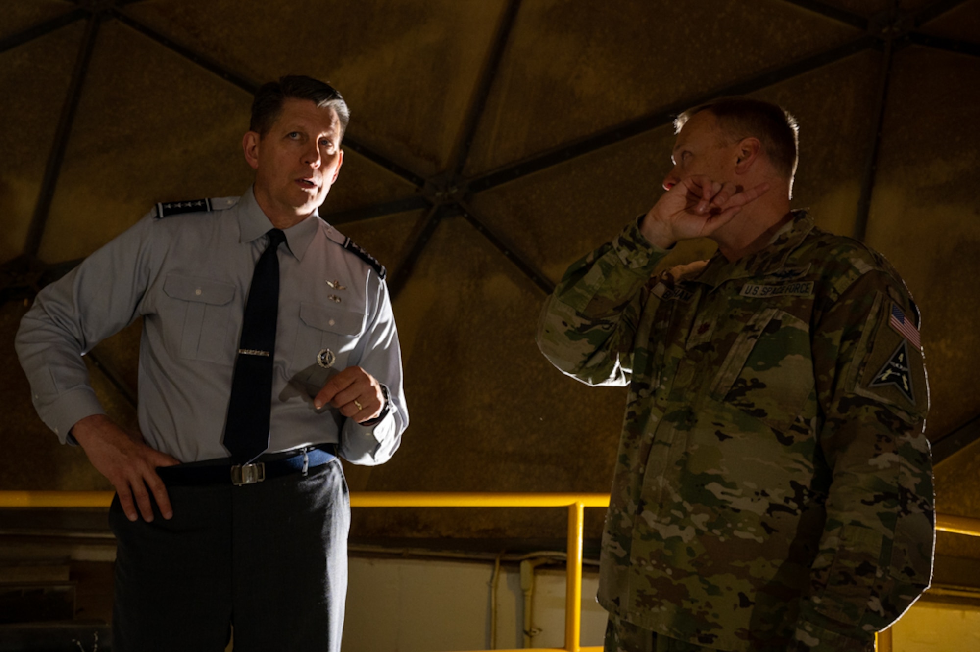 Vice Chief of Space Operations speaks with 3d Satellite Communication Squadron commander inside of a radome.