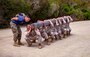 A U.S. Marine Corps drill instructor with India Company, 3rd Recruit Training Battalion, instructs recruits during log drills at Marine Corps Recruit Depot San Diego, May 8, 2023