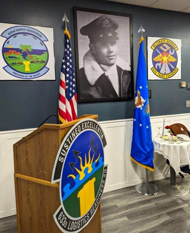 Members discuss 633d Logistics Readiness Squadron history during the dedication of their heritage room, at Joint Base Langley-Eustis, Virginia, March 24, 2023.