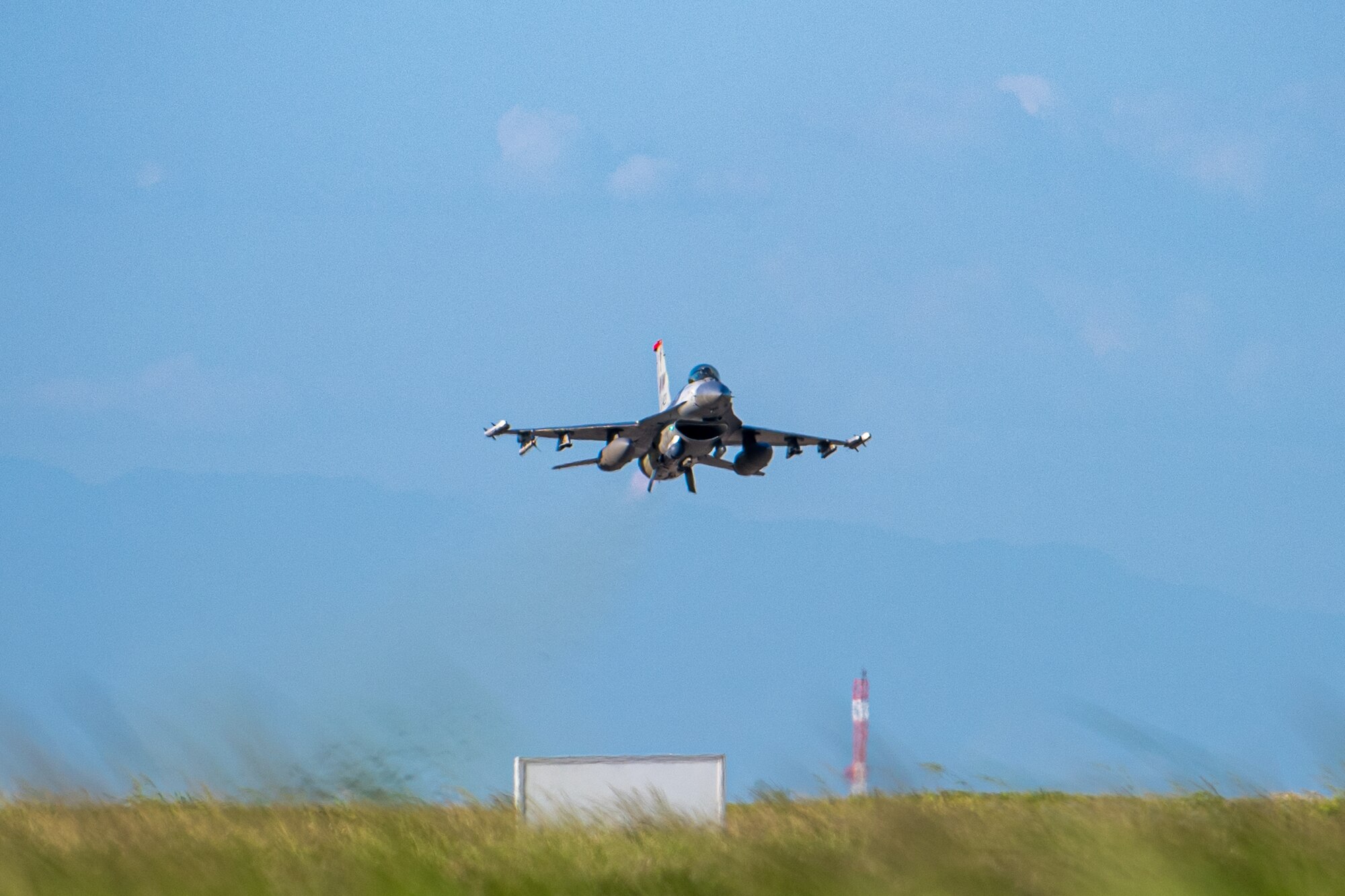 a photo of an F-16 taking off