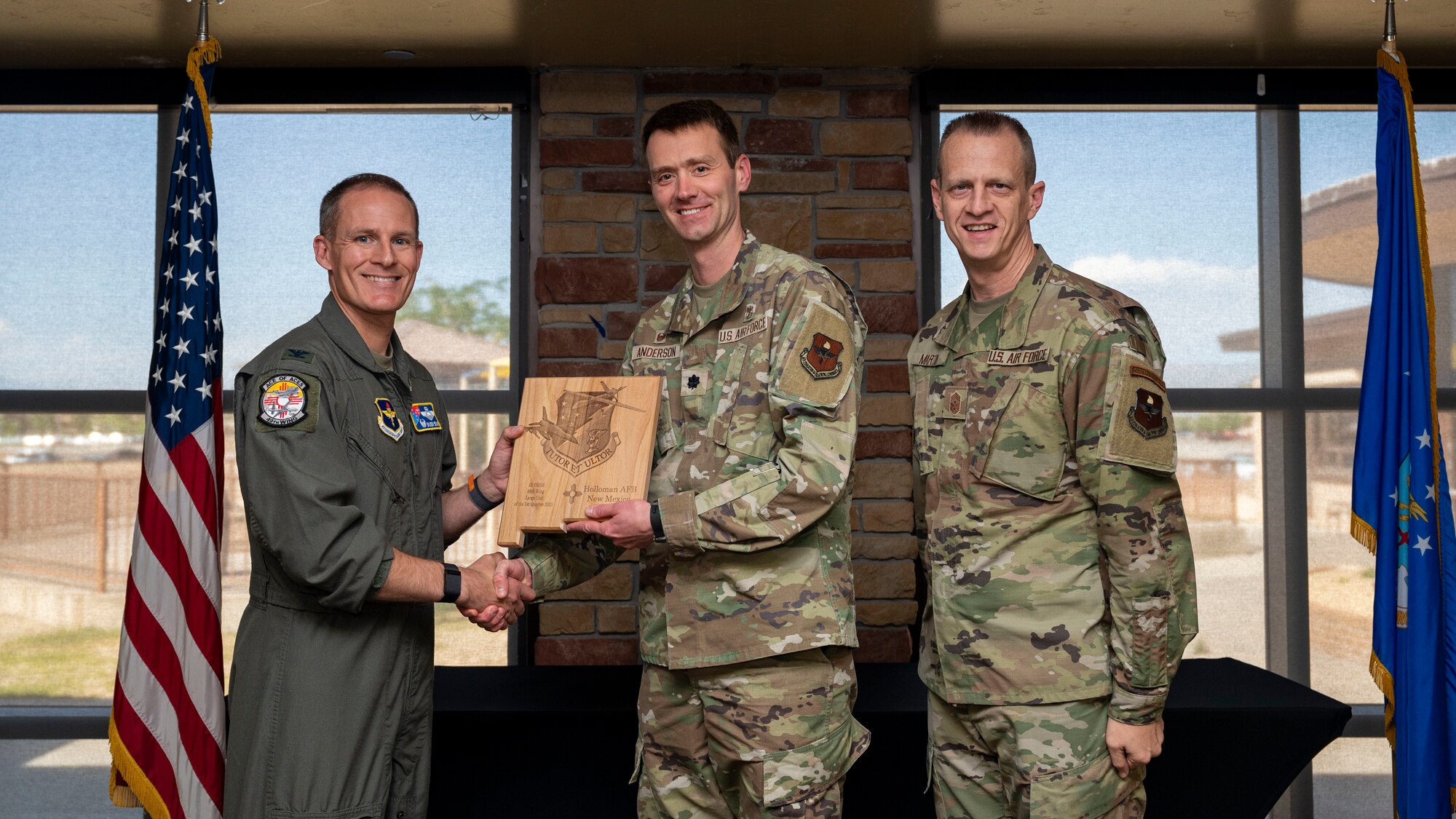 U.S. Air Force Lt. Col. Daniel Anderson, from the Operational Medical Readiness Squadron accepts the Large Unit of the Quarter Award, during the 49th Wing’s 1st Quarter Award ceremony at Holloman Air Force Base, New Mexico, May 12, 2023.