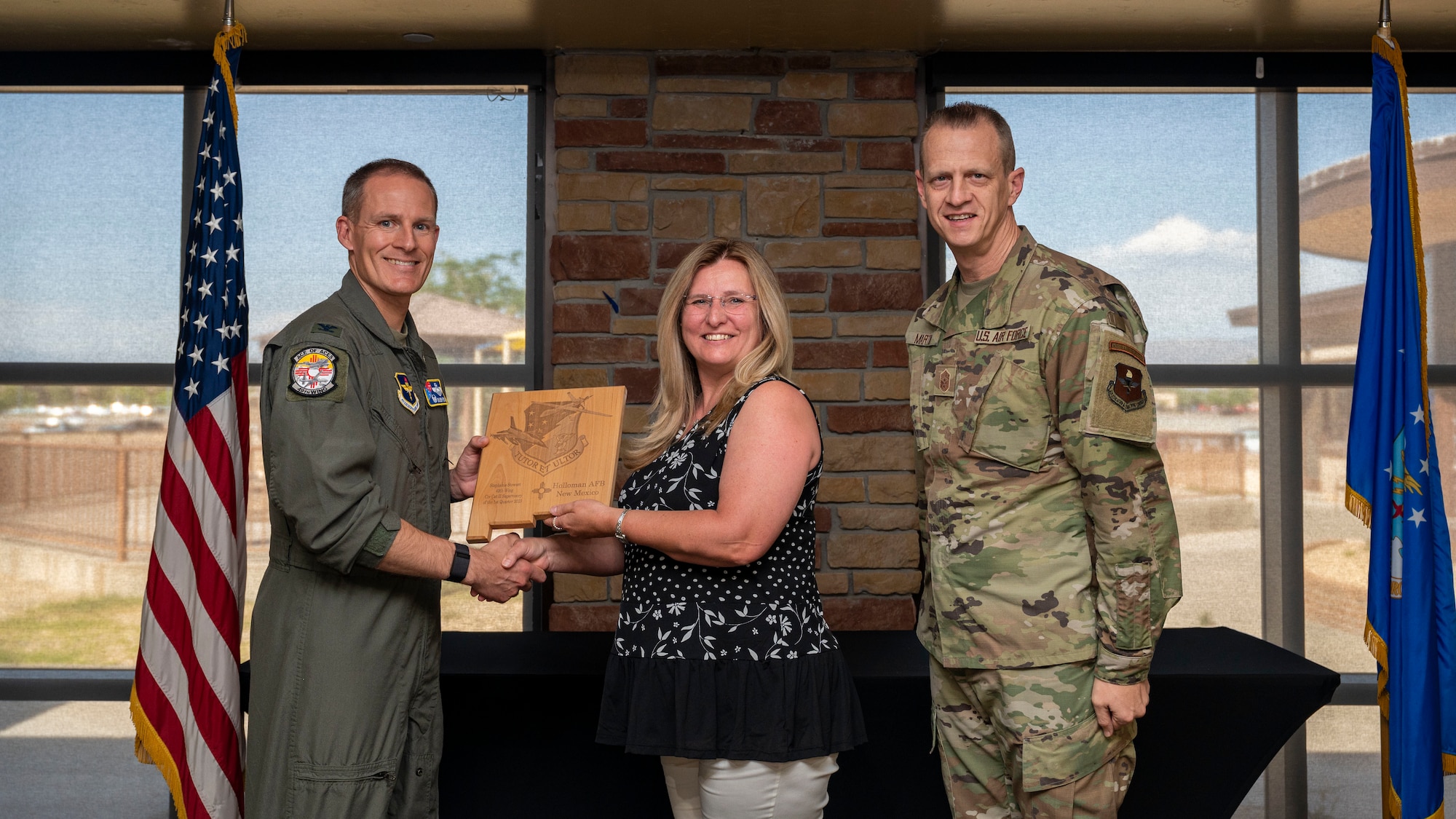 Stephanie Spencer, from the 49th Force Support Squadron, accepts the Civilian Category II (Supervisory) of the Quarter Award, during the 49th Wing’s 1st Quarter Award ceremony at Holloman Air Force Base, New Mexico, May 12, 2023.
