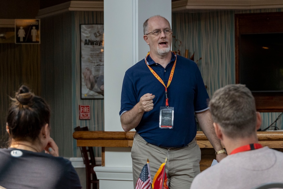 Mr. Jim Dietz, a hall of fame coach, presents a practical application brief to his fellow coaches at the coaches workshop on Marine Corps Base Quantico, Va, May 10, 2023. Coaches from across the nation travelled here to learn about the Marine Corps' officer programs. The purpose of the workshop is to create a mutually beneficial relationship between coaches and the Corps, where coaches share knowledge based on first-hand experience with colleagues, students and athletes. (U.S. Marine Corps photo by Cpl. Levi Voss)
