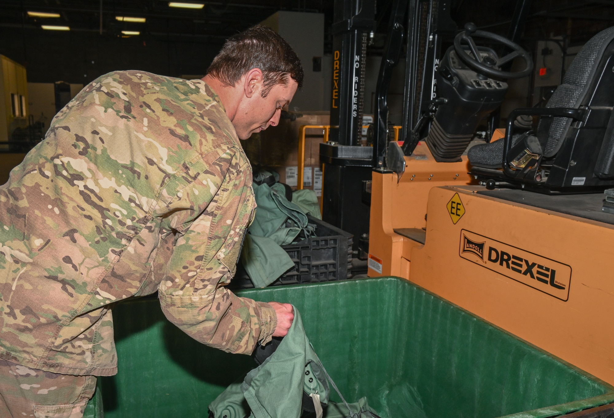 U.S. Air Force Staff Sgt. Kevin Gibson, 509th Logistics Readiness Squadron, Individual Protective Equipment Supervisor, collects the gear needed to build a member’s deployment kit at Whiteman Air Force Base, Missouri, May 9, 2023. Airmen had to break down the old kits first to build new kits. (U.S. Air Force photo by Airman 1st Class Hailey Farrell)