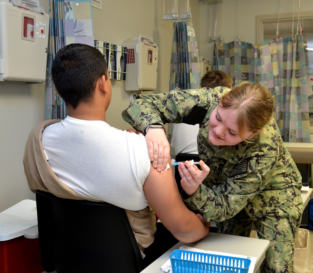 Service member receives vaccine