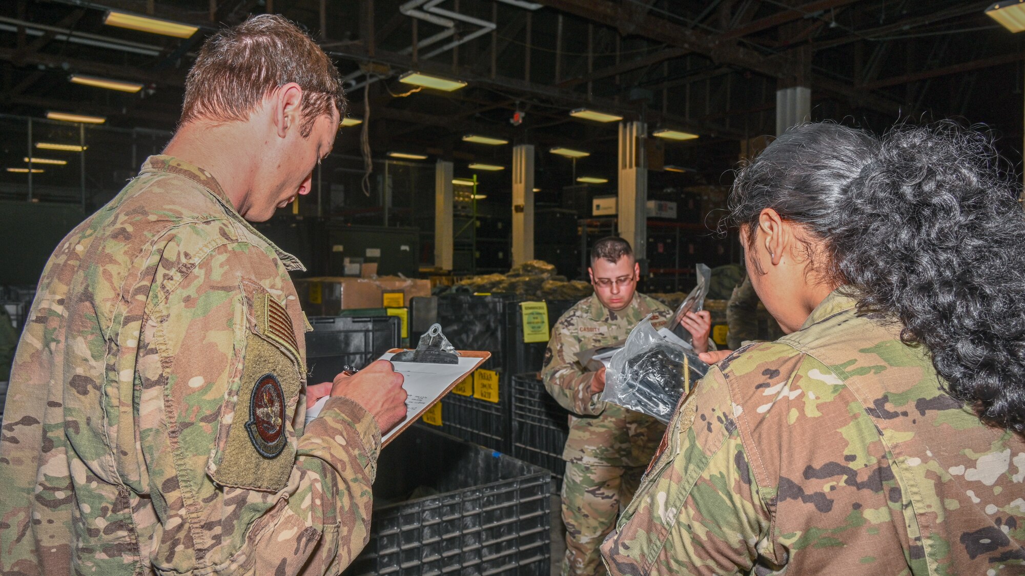 U.S. Air Force Airmen assigned to the 509th Logistics Readiness Squadron gather gear for member’s deployment kits at Whiteman Air Force Base, May 9, 2023. The idea to personalize member’s deployment kits led LRS to receive a DOD nomination for the DOD Award for Supply Chain Operational Excellence. (U.S. Air Force photo by Airman 1st Class Hailey Farrell)