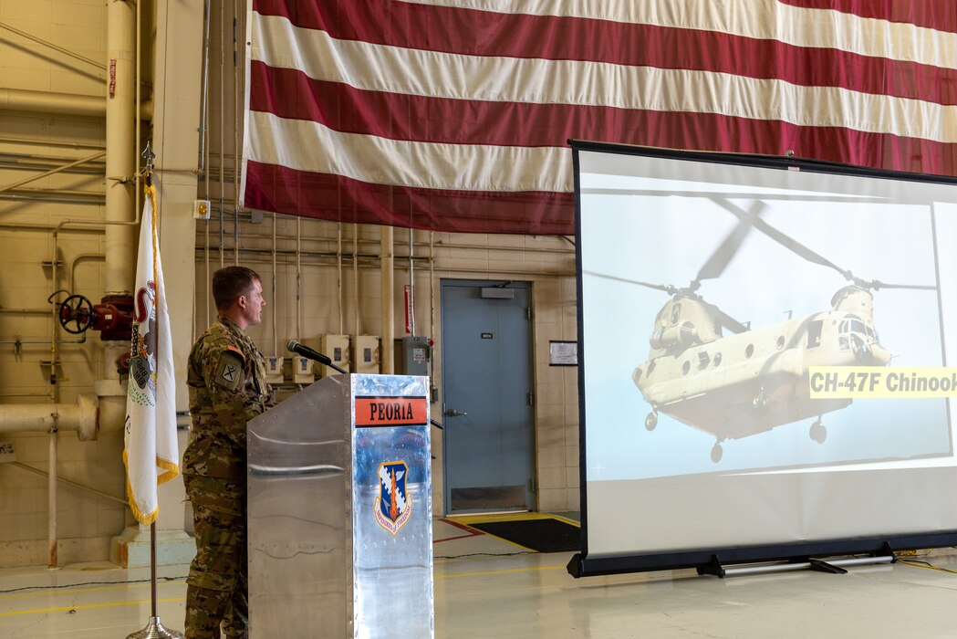 U.S. Army Chief Warrant Officer 2 Evan Guthrie, a CH-47 Chinook pilot with Company B, 2-238th General Support Aviation Battalion, speaks to civilian employers during a “Breakfast with the Boss” Boss Lift at the 182nd Airlift Wing in Peoria, Illinois, May 11, 2023.