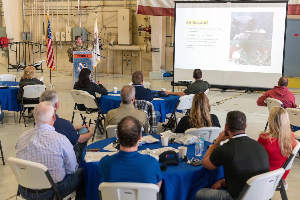 U.S. Army Chief Warrant Officer 2 Evan Guthrie, a CH-47 Chinook pilot with Company B, 2-238th General Support Aviation Battalion, speaks to civilian employers during a “Breakfast with the Boss” Boss Lift at the 182nd Airlift Wing in Peoria, Illinois, May 11, 2023.