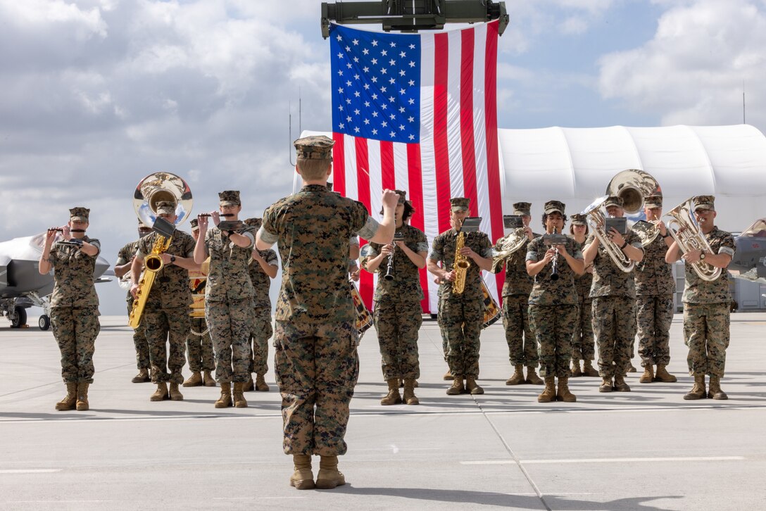 3rd MAW Band performs in front of flag