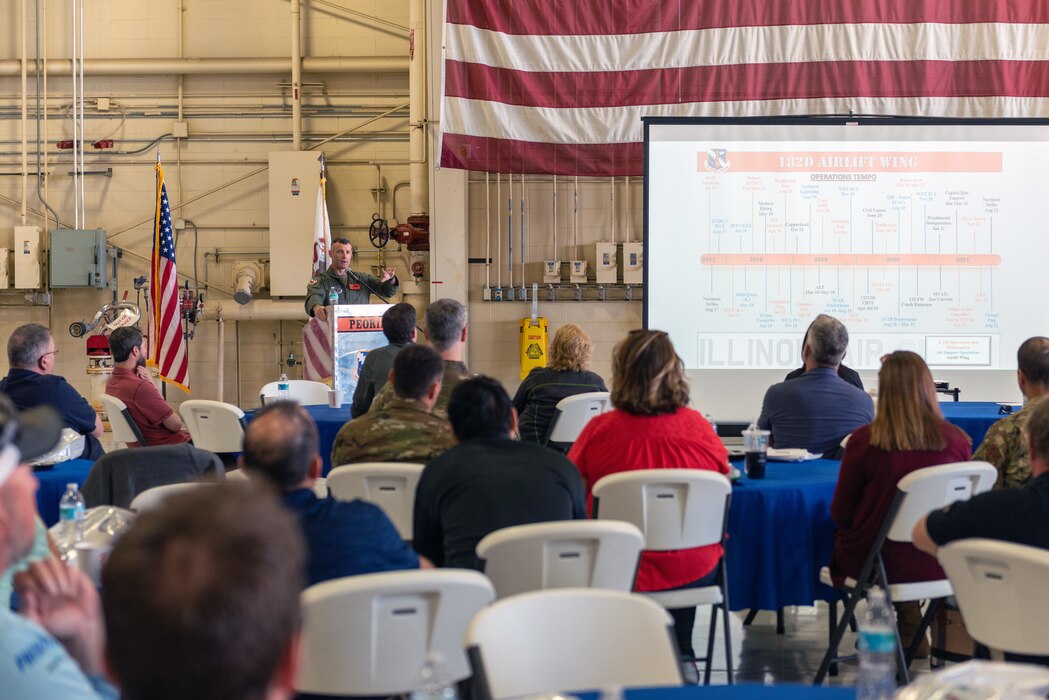 U.S. Air Force Col. Rusty Ballard, the commander of the 182nd Airlift Wing, Illinois Air National Guard, speaks to civilian employers during a “Breakfast with the Boss” Boss Lift at the 182nd Airlift Wing in Peoria, Illinois, May 11, 2023.