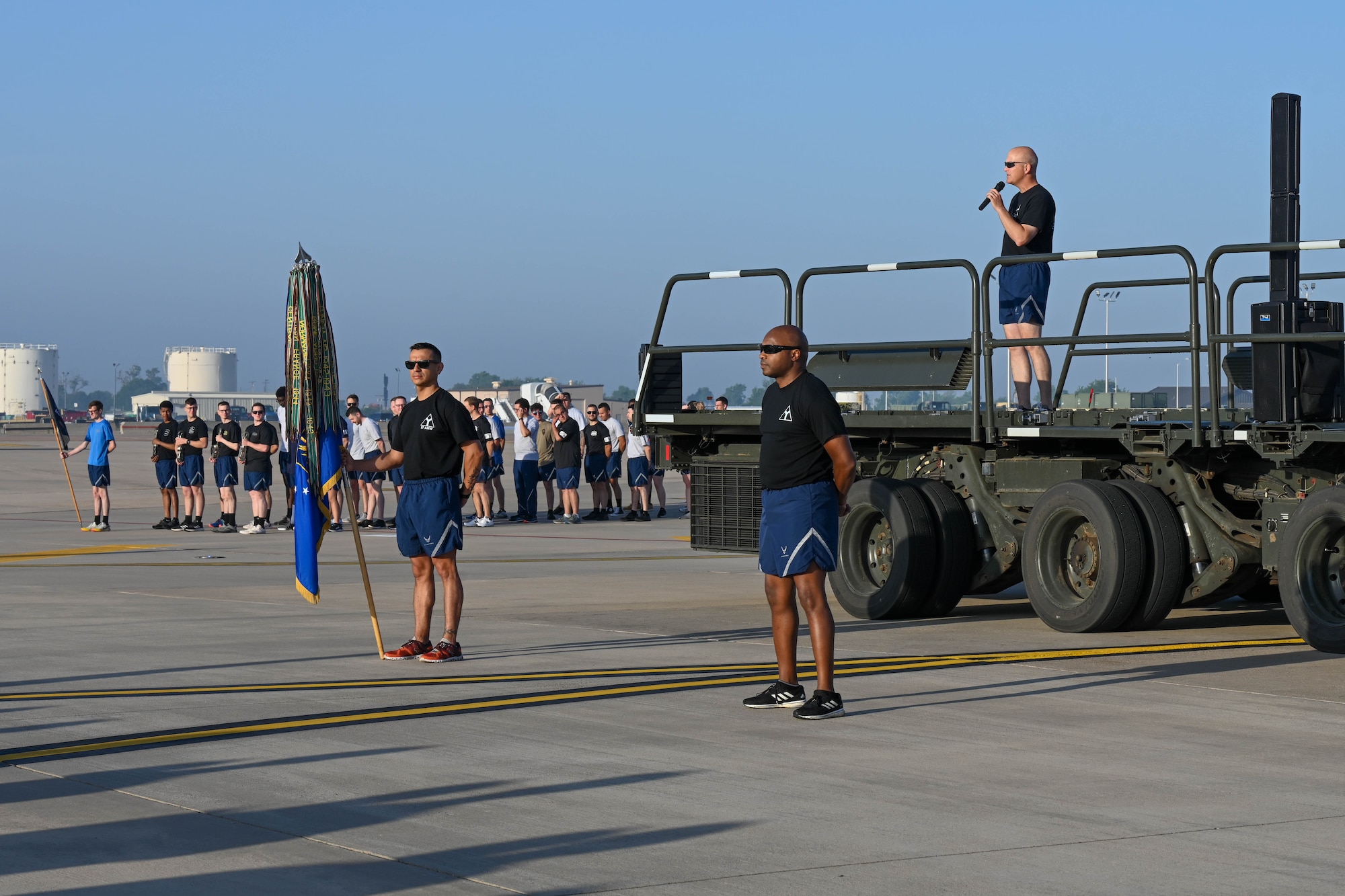U.S. Air Force Col. Blaine Baker, 97th Air Mobility Wing (AMW) commander, addresses Airmen from the 97th AMW on the flight line at Altus Air Force Base, Oklahoma, May 12, 2023. This was Baker’s final run with the wing due to his upcoming change of command ceremony. (U.S. Air Force photo by Senior Airman Trenton Jancze)