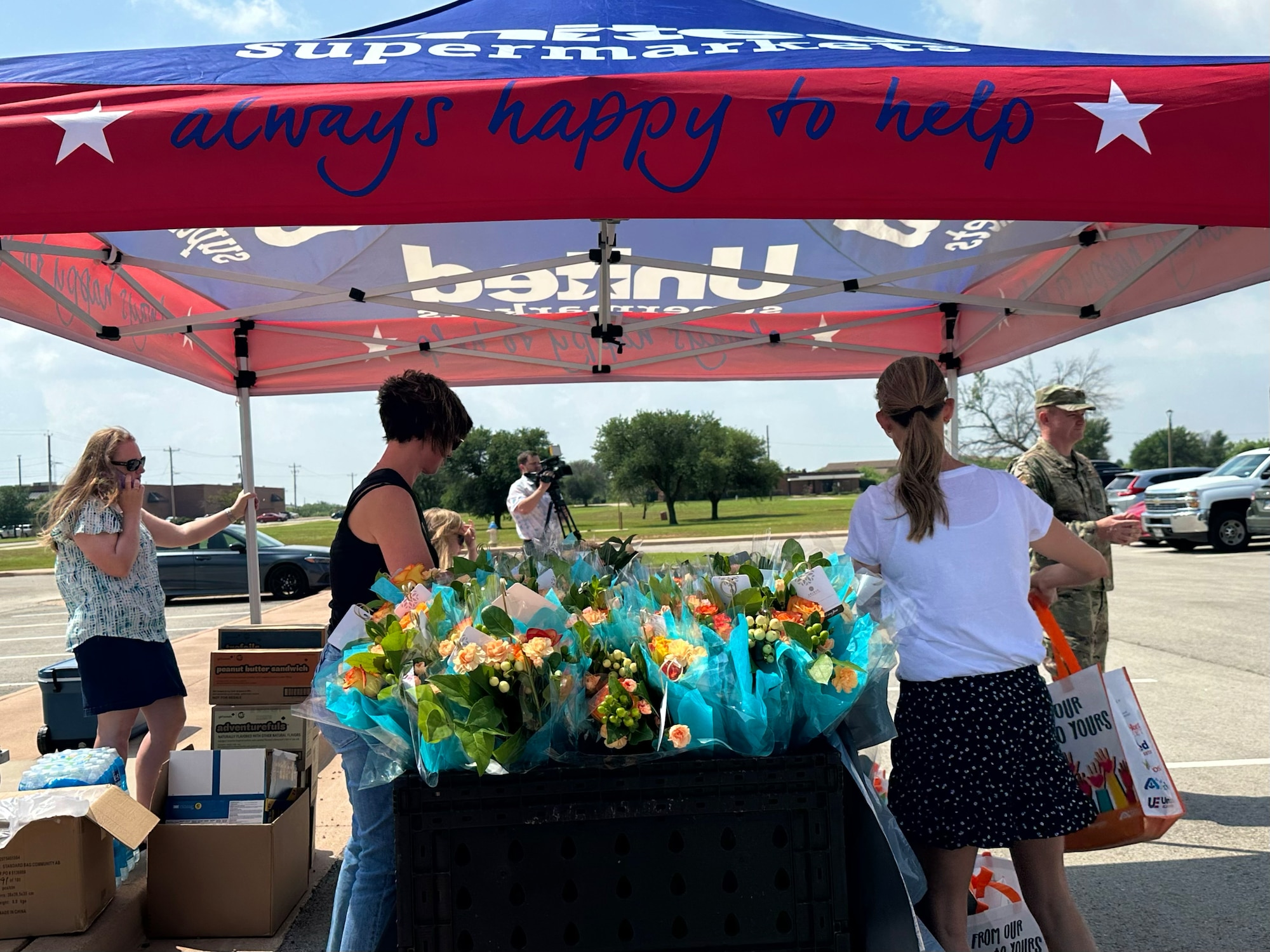 Dyess personnel prepare goodie bags at a Military Spouse Appreciation Day event at Dyess Air Force Base, Texas, May 12, 2023. Bouquets of flowers and goodie bags were distributed to military spouses to honor them for their support and sacrifices. The first Military Spouse Appreciation Day was declared in 1984 by President Ronald Reagan; the day now falls on the Friday before Mother’s Day. (U.S. Air Force photo by Airman 1st Class Emma Anderson)