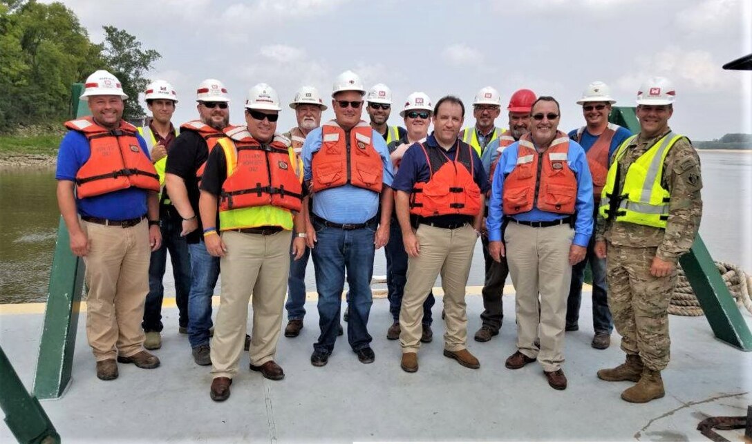Pictured, from left to right, (front row) Donny Davidson, Memphis District’s Engineering and Construction Division chief; Bill Gardiner, Luhr Bros., Inc. (contractor); Randy Chamness, Lower Mississippi River Committee (LOMRC); David Goin, LOMRC; Col. Michael Ellicott, Memphis District commander; (back row) Del Warfield, Memphis District Construction Branch; Preston Snyder, River Engineering Section; Daimon McNew, Memphis District’s Caruthersville Area Office area engineer; Steve Kuykendall, Caruthersville Area Office; Zach Cook, Memphis District’s Channel Improvement Project manager; Jacob Allen, Caruthersville Area Office; Jack Ratliff, Caruthersville Area Office; Houston Castle, Luhr Bros., Inc.; and Brandon Breckenmeyer, Luhr Bros., Inc. (AUG 2018)