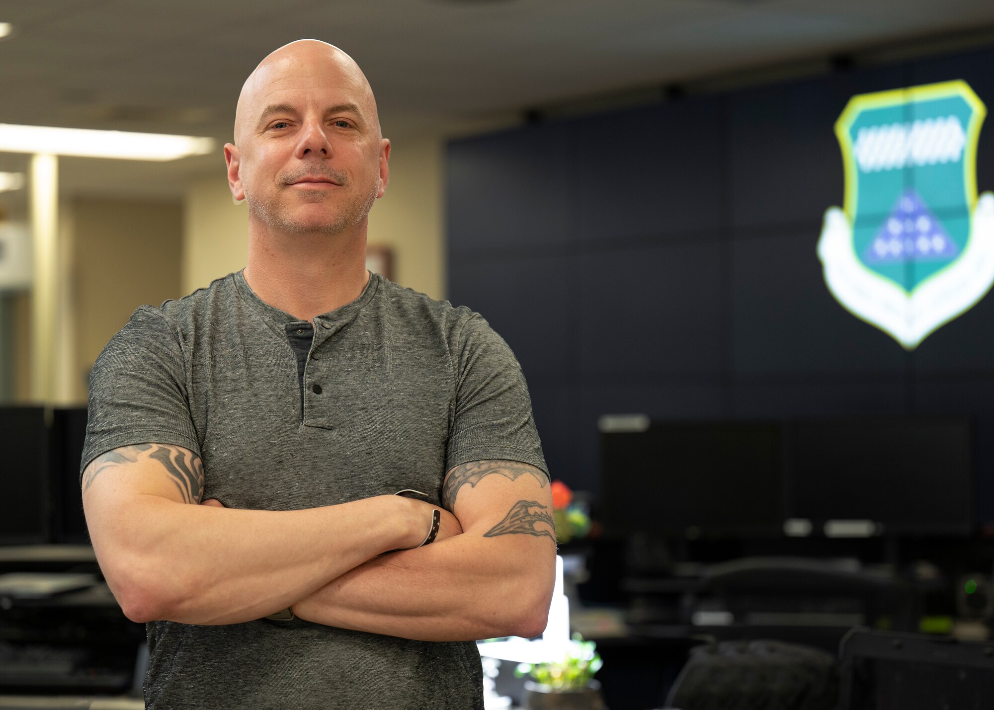 A man stands in a room full of computers.