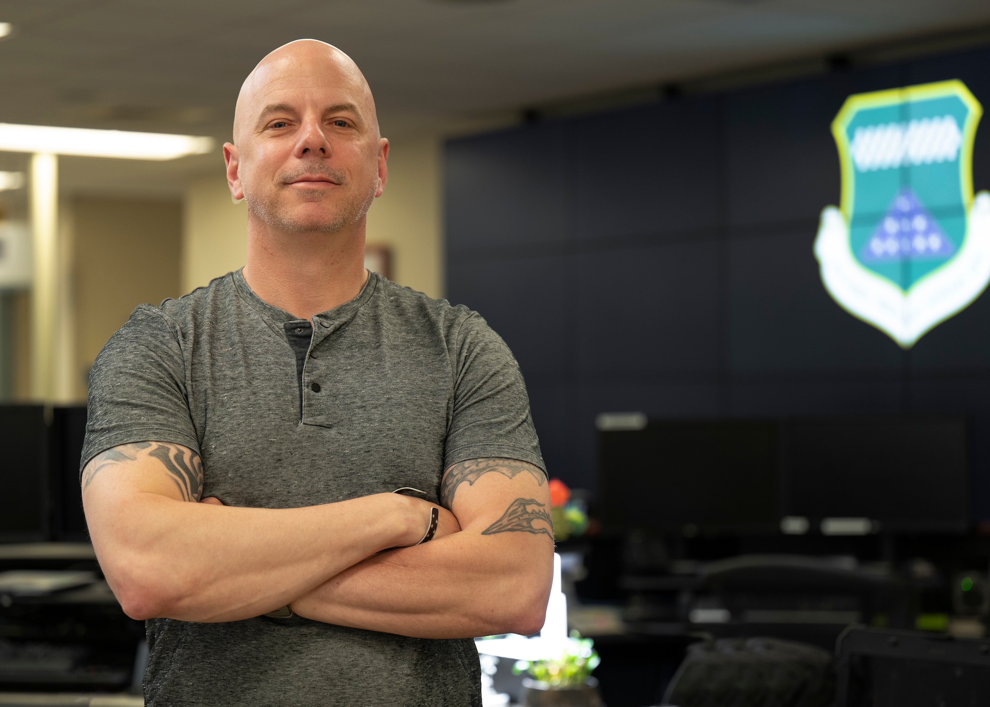 A man stands in a room full of computers.