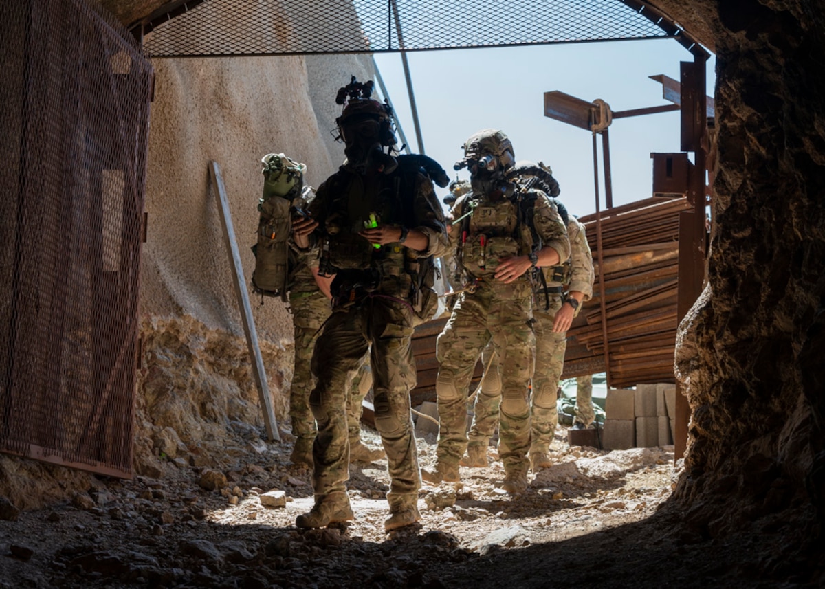 U.S. Air Force pararescuemen enter the San Xavier Mine, Ariz., May 4, 2023. The pararescuemen traversed to the bottom of the mine to rescue simulated casualties during a training exercise. (U.S. Air Force photo by Airman William Finn V)