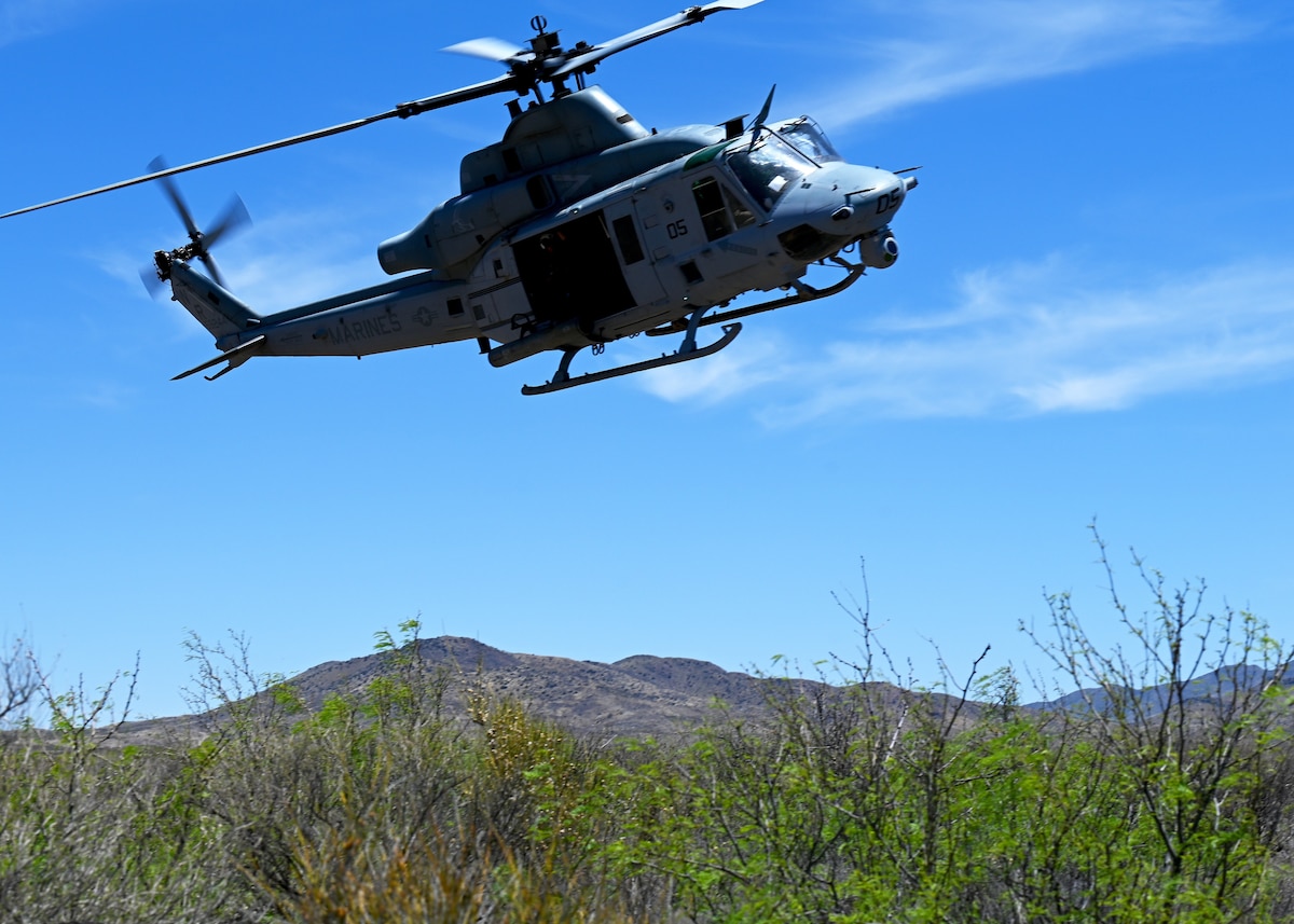 A U.S. Marine Corps UH-1Y Venom Huey utility helicopter locates the simulated downed pilot during a RED FLAG-Rescue 23-1 training exercise at Playas Training Center, New Mexico, May 9, 2023. The joint and international training exercise was designed to provide participants real life scenarios in a controlled, yet realistic, training environment. (U.S. Air Force photo by Staff Sgt. Abbey Rieves)