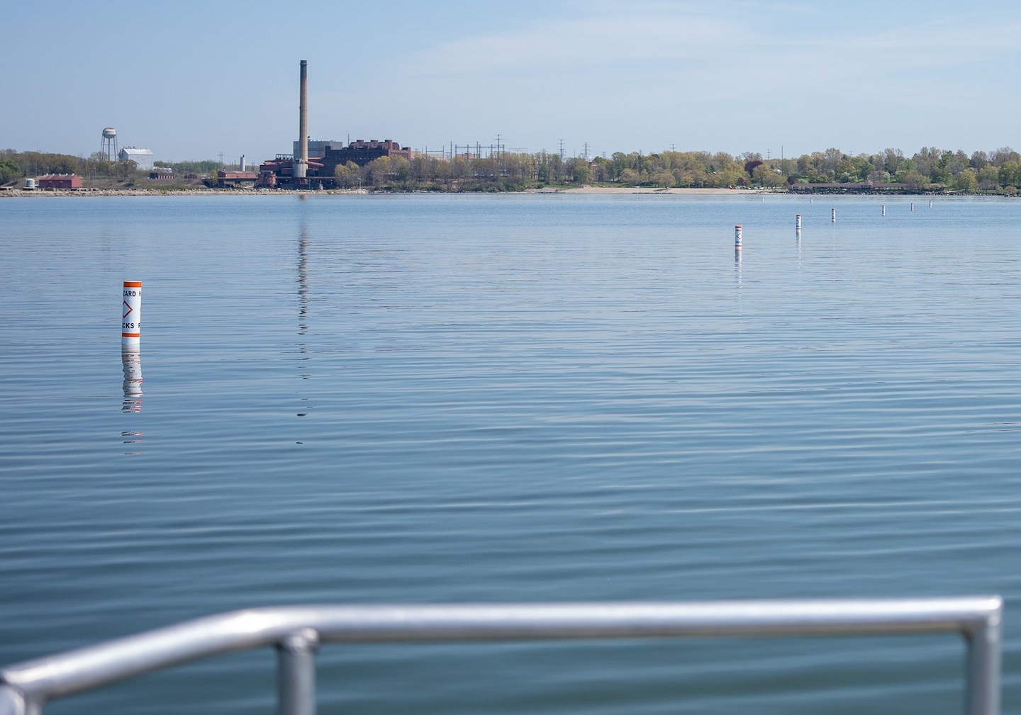 Buoys floating in the waters of Ashtabula Harbor marking the submerged stone wall that lies below.