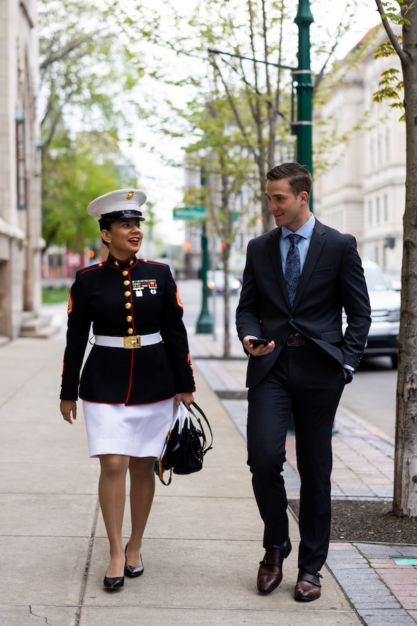 U.S. Marine Corps Staff Sgt. Laiqa Hitt, left, staff non-commissioned officer in charge and operations chief of Communication Strategy and Operations, Marine Corps Installations Pacific, and Jared Bunn, producer of “Panacea,” discuss the audience feedback after the premiere of the short documentary “Panacea” in Downtown Syracuse, New York, April 23, 2023. “Panacea” is an award winning, 25-minute, short documentary directed by Hitt and produced by Bunn that follows a dancer from Syracuse City Ballet and the hardships endured through the COVID-19 pandemic. (U.S. Marine Corps photo by Lance Cpl. Thomas Sheng)