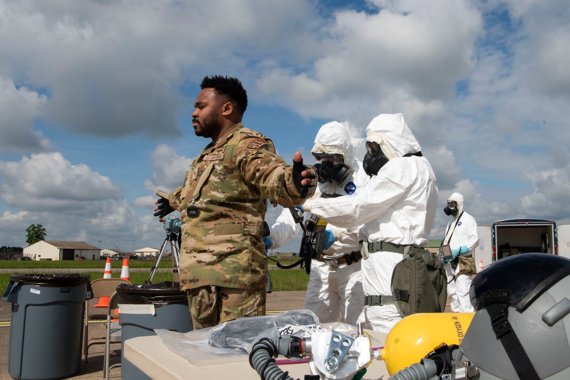 U.S. Air Force Staff Sgt. Victor Williams, 21st Surveillance Squadron Detachment 1 special equipment operator is scanned by Airman 1st Class Ethan Harlan and Airman 1st Class Miranda Dickinson, 100th Civil Engineer Squadron emergency management journeymen for contamination during an Aircraft Radiological Recovery Plan training event at Royal Air Force Mildenhall, England, May 11, 2023. The WC-135 Constant Phoenix aircraft provides a scientific mission supporting the nuclear treaty monitoring mission of the Air Force Technical Applications Center. AFTAC has been directing missions for U.S. verification of nuclear treaties for more than 35 years. (U.S. Air Force photo by Tech. Sgt. Anthony Hetlage)