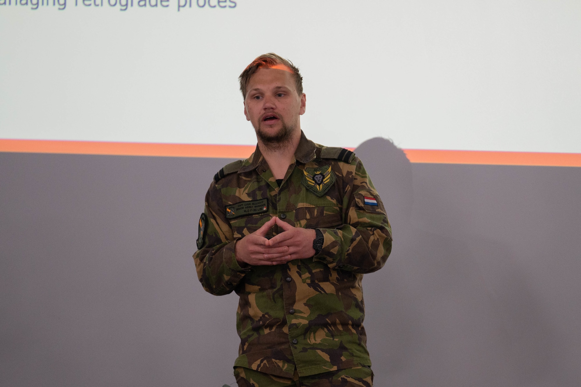 Royal Netherlands Air Force Capt. Luuk Mijlhoff, supply officer, talks about the deployment experience in Poland and Bulgaria at Royal Air Force Lakenheath, England, May 10, 2023. The F-35 European Air Chiefs meet biannually to discuss User Group issues and provide guidance, with the most recent meeting hosted by Italy in November 2022 and the next meeting scheduled for June 2023 at RAF Marham. (U.S. Air Force photo by Airman 1st Class Austin Salazar)
