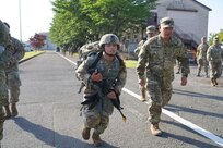 Spc. Kiana Siguenza of SECFOR 6, Task Force Talon, 38th Air Defense Artillery Brigade, competes in the ruck march portion of the U.S. Army Japan Expert Soldier Badge testing at the Sagami General Depot, Japan, April 28, 2023.  Siguenza, a member of the Guam National Guard, is the first recipient of the Expert Soldier Badge in the organization.