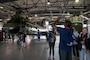 College coaches and educators observe past aircraft flown by Marine Helicopter Squadron One pilots while attending the Coaches Workshop hosted by the Marine Corps Recruiting Command at Marine Corps Base Quantico, Va., May 11, 2023. Upon completion of the workshop, attending coaches and educators will return to their schools and community equipped with a better understanding of the Marine Corps and the ability to tell the Marine Corps story. (U.S. Marine Corps photo by Lance Cpl. Gustavo Romero)