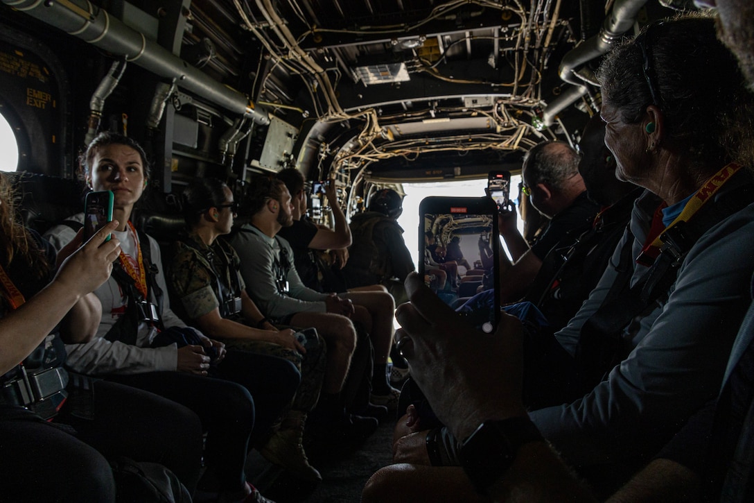 College coaches and educators exit a MV-22B 'Osprey' flown by Marine Helicopter Squadron One pilots while attending the Coaches Workshop hosted by the Marine Corps Recruiting Command at Marine Corps Base Quantico, Va., on May 11, 2023. Upon completion of the workshop, attending coaches and educators will return to their schools and community equipped with a better understanding of the Marine Corps and ability to tell the Marine Corps story. (U.S. Marine Corps photo by Lance Cpl. Gustavo Romero)